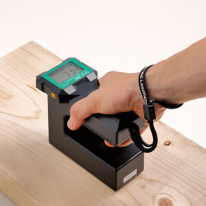 Kett HM540 Moisture Meter in use on wood board.